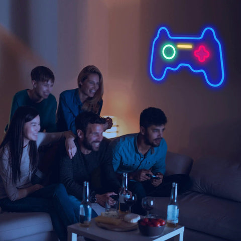Christmas Gamepad Neon Sign For Gamers 16 By 11 Inches USB Powered LED Light glowing in a room with people gaming
