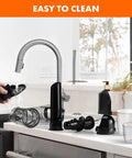 Masticating juicer attachment for KitchenAid stand mixer; black plastic parts with clear chamber on counter.