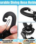 Hand holding 8 Piece Scuba Hose Clips And Silicone Snorkel Keeper Locks Kit For Regulators Masks Snorkels And BCD Gear.