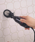 Grout Removal Rotary Tool Attachment For Tile Grout Lines With A 30 Degree Cutting Angle Centered Guides Large Visibility Window And Depth Adjustment To Three Eighths Inch For Wall And Floor Grout By Dremel in use on wall tiles