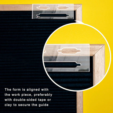 Slick Clear Acrylic Keyhole Slot Routing Template For Hanging Picture Frames And Woodworking Projects aligned with a wooden frame.