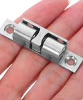 Copper Ball Door Catch Cabinet Latch Hardware Set 50mm Silver Roller Catch 4 Pack displayed on a hand
