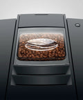 Fully Automatic Chrome Espresso Machine One Touch Custom Barista Brewer Fresh Bean Grinder Premium Coffee Maker Top Shelf Brewmaster smooth view of coffee beans in grinder compartment.