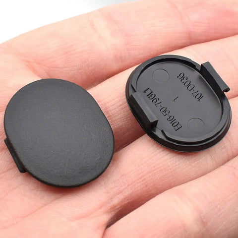 2 Pack E01650796 Windshield Cowl Grille Screw Hole Cap Rubber Covers shown in hand, black plastic, Mazda Miata MX5
