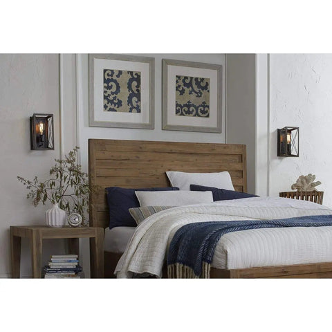 Cozy bedroom with Briarwood Antique Bronze One Light Wall Sconce With Faux Wood Look Farmhouse Architectural Lighting over bedside tables