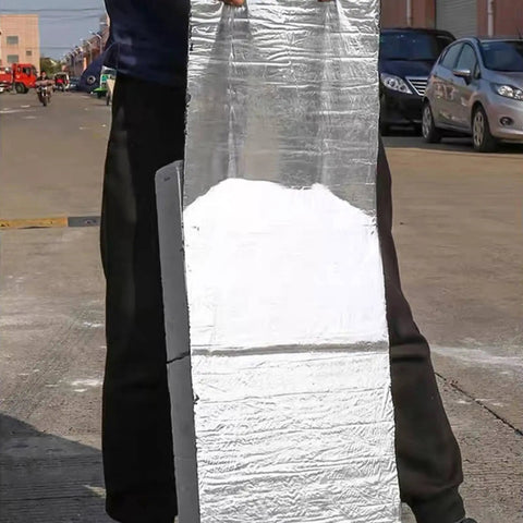 Hella Tough Asphalt Roof Shingle Repair Tape With Reflective Aluminum Foil Backing, showing 1 meter wide roll held upright.