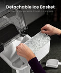 Hands using Chewable Nugget Ice Maker Countertop 35 Lbs Per Day Portable Sonic Ice Machine with detachable ice basket.