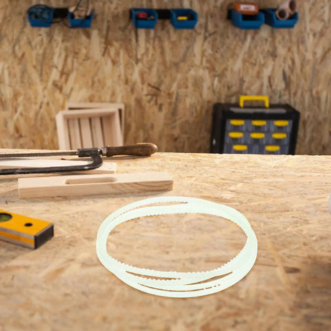 Tough As Nails Rubber Drive Belts Pack Of Four For Heavy Duty Industrial Sealers on workbench amidst tools.