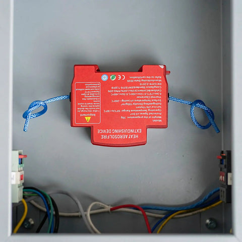 Automatic Car Fire Extinguisher Compact Aerosol Unit With Slick Peel Stick Install For Instant Flame Stop And Solid Vehicle Safety Hassle Free Essential Emergency Ride Guard Gear visible mounted in electrical enclosure.