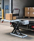 Heavy Duty Electric Scissor Lift Table Cart With 660 Pound Capacity And 52 Inch Max Height, showing a portable hydraulic flatbed handcart unloading a box.