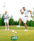 Putting Green Indoor Set Two Pack With Cups And White Flag Portable Golf Practice Kit in use on outdoor green by two players