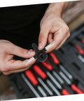 Person holding component from Beefed Up Roller Skate Base Plate Assembly Kit With Shock Absorbing Hardware For Four Wheel Inline Skating Sturdy Steel Bracket For Smooth Drifting And Reliable Replacement Accessories.