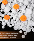Assorted 200Pcs white plastic and orange gears, module 0.5 for DC motors, ideal for RC cars and DIY robot projects.
