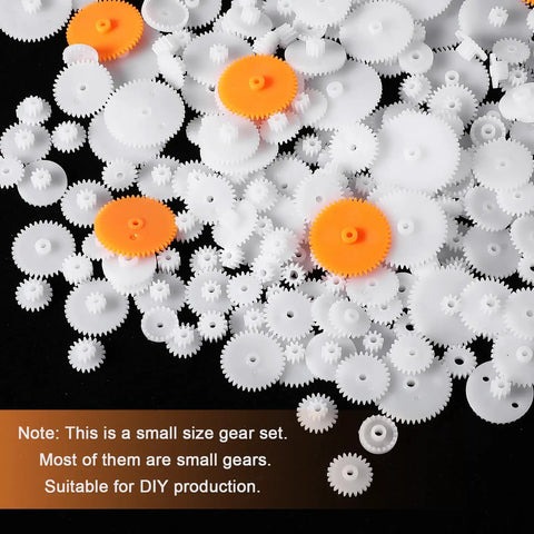 Assorted 200Pcs white plastic and orange gears, module 0.5 for DC motors, ideal for RC cars and DIY robot projects.