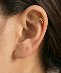 Gold Bow Stud Earrings For Women Titanium Flat Back Screw Back Hypoallergenic Nickel Free Lightweight showcased on an ear.