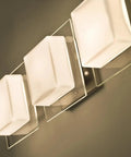 Contemporary Alex Wall Sconce With Handcrafted Opal And Clear Glass In A Sleek Satin Nickel Finish, showcasing three layered glass shades.