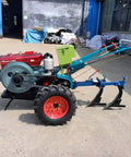Compact 2 Wheel Walking Tractor For Small Farms And Gardens With A Workhorse Cultivation Tiller Motocultor parked in an outdoor area