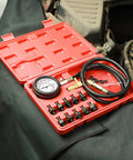 Oil pressure tester tool kit with 0–140 PSI gauge, red case, hoses and assorted brass adapters