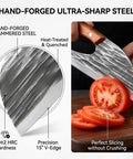 Hand-forged steel blade cutting tomato, showcasing Do It All Hand Forged Chef Knife And Cleaver Set With Carbon Steel Blades.