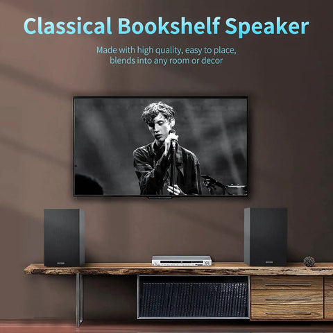 Powered 4 Inch Bookshelf Speakers With Deep Bass And Silk Dome Tweeters Bluetooth 5.0 next to TV on wooden console in living room