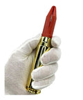 Gloved hand holding 20mm Phalanx CIWS Dummy Round Kit With Red Sabot, Tungsten Penetrator, Stand, Reconditioned Fired Case, Inert Display