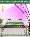 Ultra Thick 160 Cell Seed Starter Tray Kit With Humidity Dome on heat mat with plant lights, displayed on a table