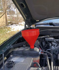 Polyethylene Plastic Funnel With Screen And Hanging Tab, 2 Quart Capacity, in use in car engine bay, ideal for fluids and oils