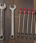 Five Pack Battery Tricycle Charging Cable Connector For EVs, wrenches and cables displayed on wooden surface