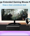 Extra Large Gaming Mouse Pad With Stitched Edges, Premium Microfiber Surface, Waterproof Non Slip Desk Mat 31.5 By 11.8 Inches For Home Office And Gaming Setup, Keyboard, Mouse, Laptop, And More, Black on a desk with keyboard and monitor