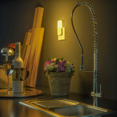 Plug In Night Light With Smart Dusk To Dawn Sensor, Warm White LED Night Light illuminating a kitchen counter at night
