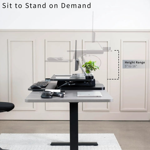 No Brainer Height Adjustable 25 Inch Standing Desk Converter for Sit and Stand Setup with gas spring support in home office