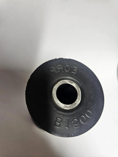 Top view of one rubber bushing from DOM Builder Bushings Pack of 2 for Fab Shops, showing inner steel sleeve and markings.