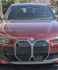 BMW G26 I4 Front Bumper License Plate Relocator Tow Hook Mount Bracket Version 2 Easy Install on red BMW car front view