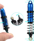 Close-up of blue 4 Piece CNC Machined Aluminum Front And Rear Threaded Shock Absorber Set for 1/16 RC Mini Buggy upgrades in hand