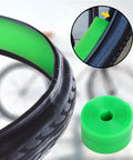 Green Two Pack Bike Tire Liners For Flat Protection, Bicycle Rim Tape And Rim Strip Protectors shown on a bike tire