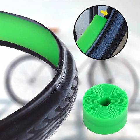 Green Two Pack Bike Tire Liners For Flat Protection, Bicycle Rim Tape And Rim Strip Protectors shown on a bike tire