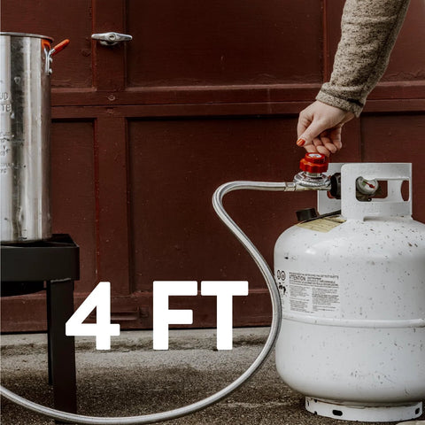GasOne 2113 propane regulator with red adjustment knob and 4 ft steel braided hose connected to a white propane tank.
