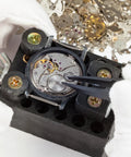 Close-up of watch mechanism repair using 100 Piece Watch Screw Kit For Repair And Battery Replacement With Stainless Steel Clamp Screws