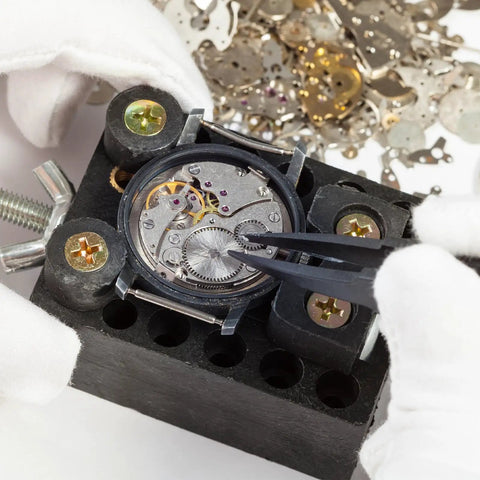 Close-up of watch mechanism repair using 100 Piece Watch Screw Kit For Repair And Battery Replacement With Stainless Steel Clamp Screws