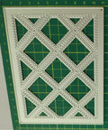 Close-up of metal stencil embossing template, diamond pattern for 3D Floral Background Frame Cutting Dies Set, carbon steel material.