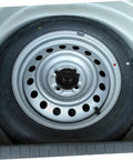 Spare tire secured with Sturdy Spare Tire Hold Down Bolt With Easy Install Design For Car And Truck Wheel Replacement Durable Long Lasting.