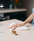 Person using Pack Of 50 White 12 By 12 Inch Cotton Terry Cleaning Cloths For Auto Detailing, Painters, And General Cleaning on countertop