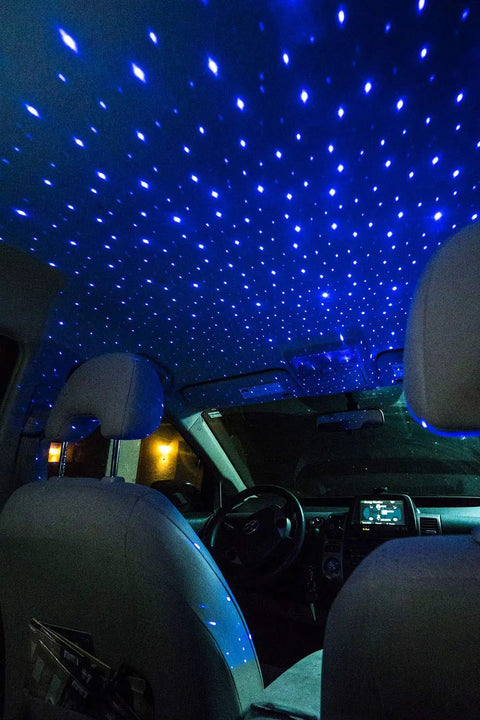 Interior view with Starport USB Laser Star Projector For Game Rooms And Bedrooms, Portable Galaxy Mood Lighting creating starry blue effect
