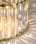 Close-up of Brushed Gold Crystal Pendant Light With Adjustable Rods And Sloped Ceiling Mount showing metal frame and crystal design.