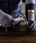 LOCCEF gray micro-foam nitrile coated work gloves; front view of gloved hands hammering a nail into wood.