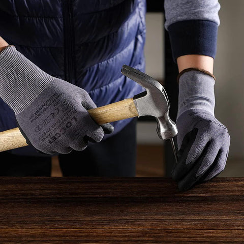 LOCCEF gray micro-foam nitrile coated work gloves; front view of gloved hands hammering a nail into wood.