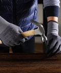 Person using a hammer while wearing MicroFoam Nitrile Coated Work Gloves With Seamless Knit Nylon Ultra Grip and Dexterity Size 9L.