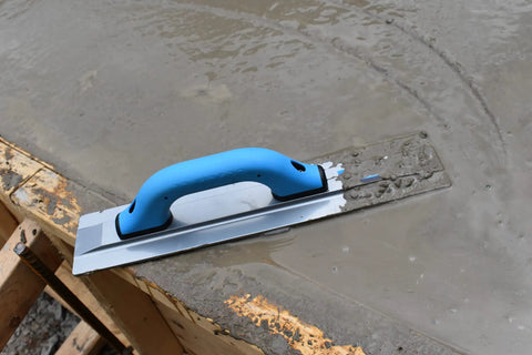 Pro-Grade Magnesium Concrete Float 3-1/8 x 16 In With Beveled Ends And Rounded Corners on wet concrete slab