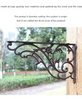 Heavy Duty Cast Iron Triangle Shelf Brackets Wall Mounted Floating Bracket side angle on wooden post outdoors showcasing intricate design.
