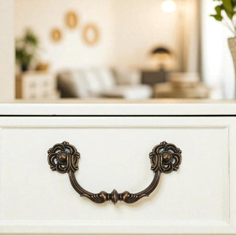 4-Pack Antique Brass Drawer Pulls 4.5 Inch Center-to-Center Drop Bail Dresser Handles Vintage Style Bronze Look Hardware on White Drawer